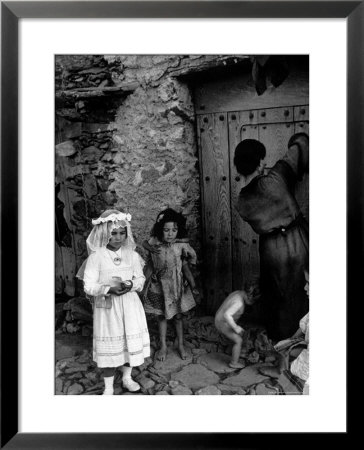 Lorenza Curiel In White First Communion Dress Waiting For Mother To Lock Door by W. Eugene Smith Pricing Limited Edition Print image