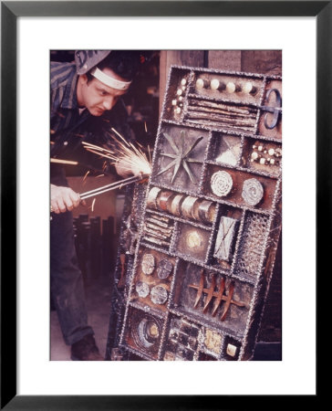 Maker Of Metal Furniture, Paul Evans, Hope, Pa., Burnishes Door Of Steel Chest With Acetylene Torch by Nina Leen Pricing Limited Edition Print image