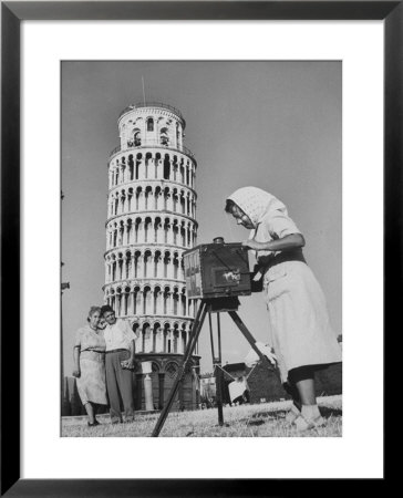 New England Couple Being Photographed By An Italian Woman In Front Of The Eifel Tower by Jerry Cooke Pricing Limited Edition Print image