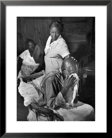 Nurse Midwife Maude Callen Tenderly Caring For An Old Chair-Bound Paralytic Touched By Her Kindness by W. Eugene Smith Pricing Limited Edition Print image