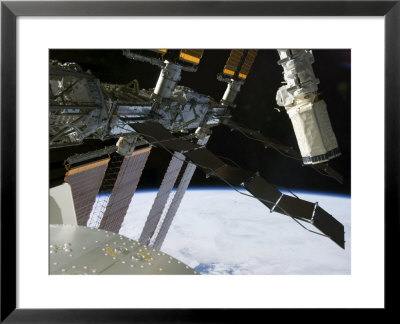 End Effector Of Endeavour's Robot Arm Appears Amidst Parts Of The International Space Station by Stocktrek Images Pricing Limited Edition Print image