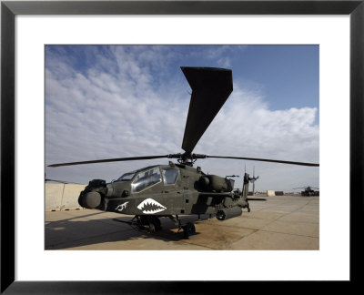 Ah-64 Helicopter Sits On The Flight Line At Camp Speicher by Stocktrek Images Pricing Limited Edition Print image