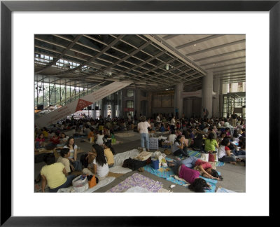 Philippino Housekeepers Gathering Together On Sundays At Hsbc Bank Hall, Hong Kong, China by Sergio Pitamitz Pricing Limited Edition Print image