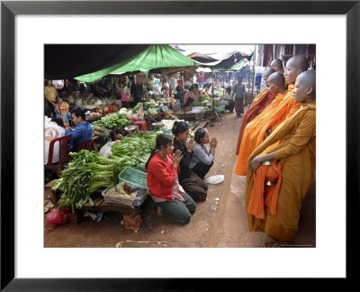 Buddhist Monks Collecting Alms In The Market Town Of Phum Swai Chreas, Eastern Cambodia, Indochina by Andrew Mcconnell Pricing Limited Edition Print image