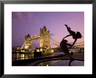 Tower Bridge And Girl With A Dolphin Fountain Statue At Dusk, London, England by Michele Falzone Pricing Limited Edition Print image