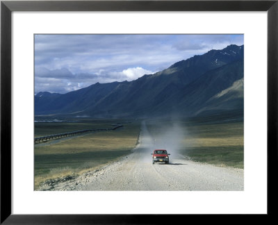 Truck On The Dalton Highway Following The Alyeska Pipeline, Alaska by Rich Reid Pricing Limited Edition Print image