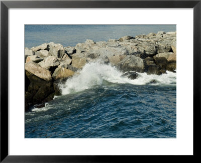 Wave Rolling Against Rock Jetty At Old Harbor On Block Island, Rhode Island by Todd Gipstein Pricing Limited Edition Print image