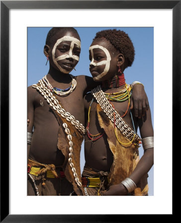 Two Hamer Girls Wearing Traditional Goat Skin Dress Decorated With Cowie Shells, Turmi, Ethiopia by Jane Sweeney Pricing Limited Edition Print image