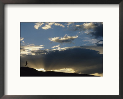 Silhouetted Figure Trail Running Under A Cloud Filled Sky by Bobby Model Pricing Limited Edition Print image