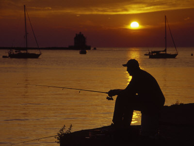 Silhouette Of Man Fishing, Lake Erie, Lorain, Oh by Jeff Greenberg Pricing Limited Edition Print image