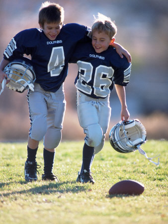 Young Football Players Walking On Field by Joseph D. Poellot Pricing Limited Edition Print image