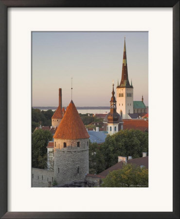Medieval Town Walls And Spire Of St. Olav's Church At Dusk, Tallinn, Estonia, Baltic States by Neale Clarke Pricing Limited Edition Print image
