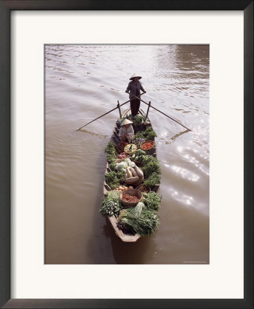Floating Market Trader And Boat Laden With Vegetables, Phung Hiep, Mekong River Delta, Vietnam by Gavin Hellier Pricing Limited Edition Print image