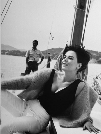 Natalie Wood Lounging On The Deck Of A Sailboat In The Riviera by Paul Schutzer Pricing Limited Edition Print image