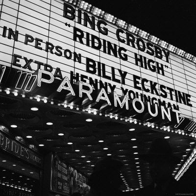 Lighted Marquee Of Paramount Theater Advertising Bing Crosby In Riding High by Martha Holmes Pricing Limited Edition Print image