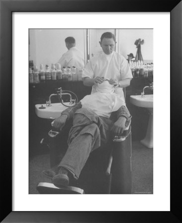 Man Receiving A Shave In A Barber Shop by Cornell Capa Pricing Limited Edition Print image