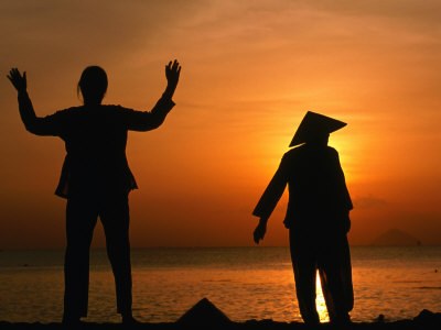 Women Exercising At Sunset On Beach, Nha Trang, Khanh Hoa, Vietnam by John Banagan Pricing Limited Edition Print image