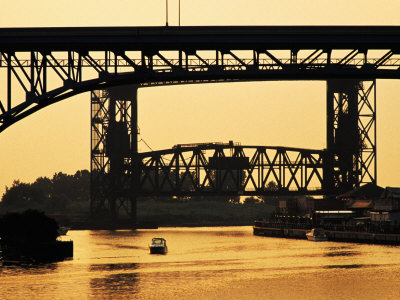 Bridges Over Cuyahoga River At Dusk, Cleveland, United States Of America by Richard I'anson Pricing Limited Edition Print image