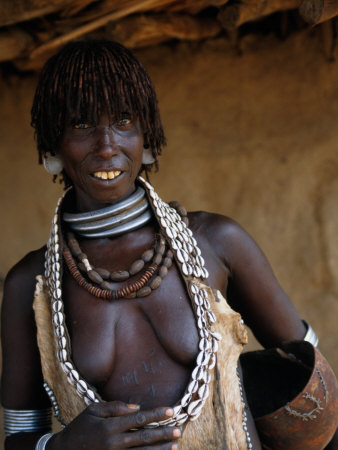 Portrait Of A Hamer Woman With Plaited Ochre-Coloured Hair In Weita, Omo National Park, Ethiopia by Ariadne Van Zandbergen Pricing Limited Edition Print image