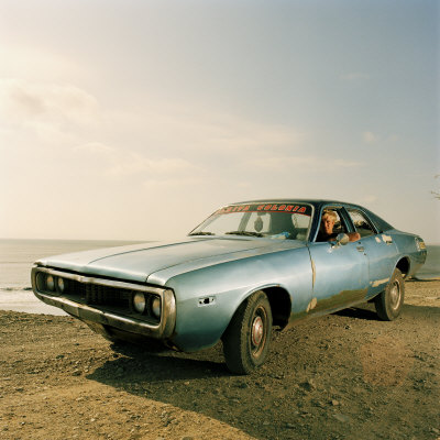 Man Sitting In His Car, Chicama, Peru by Christian Aslund Pricing Limited Edition Print image