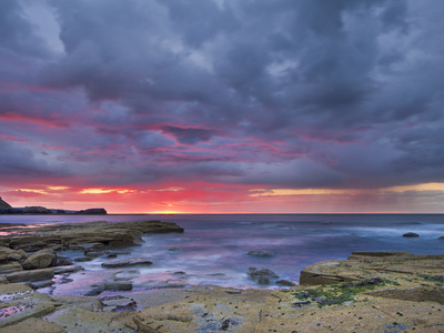 Sunset And Stormy Clouds At Low Tide In Saltwick Bay, Yorkshire, England, United Kingdom, Europe by Lizzie Shepherd Pricing Limited Edition Print image