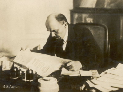Vladimir Ilich Ulyanov Lenin Russian Statesman Reading A Copy Of Pravda In His Study by B.H. Aehuh Pricing Limited Edition Print image
