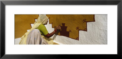 Woman Painting On A Wall, Thar Desert, Jaisalmer, Rajasthan, India by Panoramic Images Pricing Limited Edition Print image