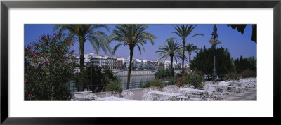 Sidewalk Cafe At The Riverside, Guadalquivir River, Seville, Spain by Panoramic Images Pricing Limited Edition Print image