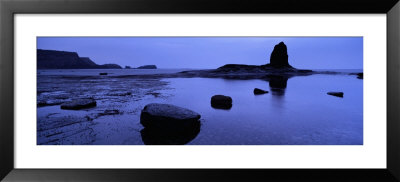 Silhouette Of Rocks On The Beach, Black Nab, Whitby, England, United Kingdom by Panoramic Images Pricing Limited Edition Print image