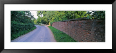 Brick Wall And Curved Road, United Kingdom by Panoramic Images Pricing Limited Edition Print image