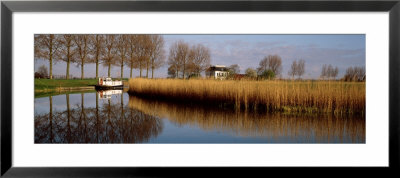 Boat On A Pond, Oudendijk, Holland by Panoramic Images Pricing Limited Edition Print image