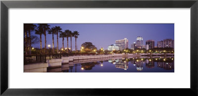 Reflection Of Buildings In The Lake, Lake Luceme, Orlando, Florida, Usa by Panoramic Images Pricing Limited Edition Print image