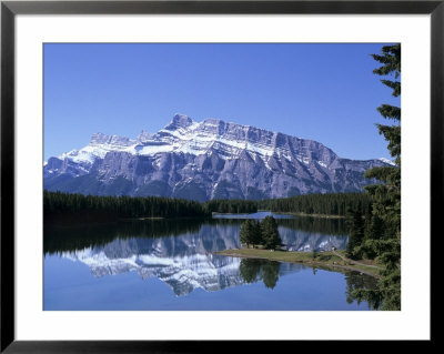 Snowy Peak Of Mount Rundle Reflected In The Water Of Two Jack Lake, Banff National Park, Alberta by Pearl Bucknall Pricing Limited Edition Print image