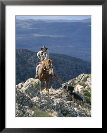 Man On Horse With Dogs, 'The Man From Snowy River', Victoria, Australia by Claire Leimbach Pricing Limited Edition Print image