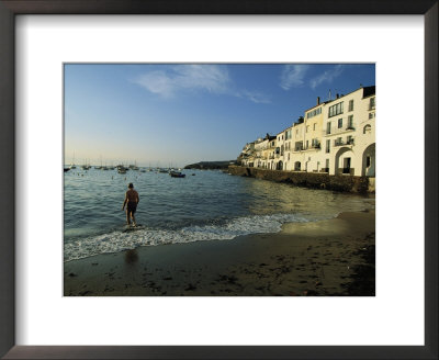 A Beach Goer Wades Into The Calm Surf Of Cadaques by Pablo Corral Vega Pricing Limited Edition Print image