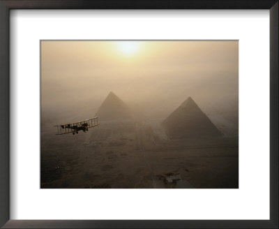 The Vimy Flies Above Fog-Shrouded Pyramids During A Golden Sunrise At Giza, Egypt by James L. Stanfield Pricing Limited Edition Print image