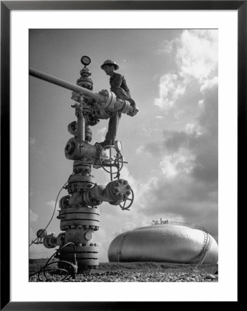 Workman Standing On Machinery At Natural Gas Plant by Thomas D. Mcavoy Pricing Limited Edition Print image