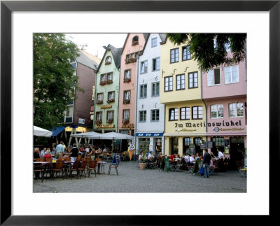 People Sitting At Outdoor Restaurant In The Old Town, Cologne, Germany by Yadid Levy Pricing Limited Edition Print image