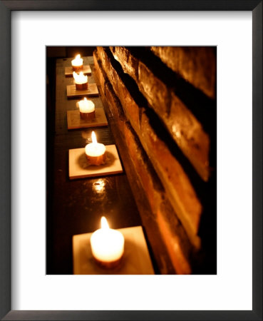 Lighted Candles And Brick Wall by Michele Molinari Pricing Limited Edition Print image