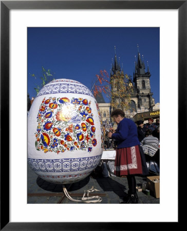A Moravian Woman Decorating A Large Egg With Easter Designs On The Old Town Square, Prague by Richard Nebesky Pricing Limited Edition Print image