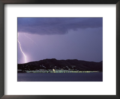 A Lightning Bolt Strikes The Mountains Behind A Town Of Costa Brava by Pablo Corral Vega Pricing Limited Edition Print image