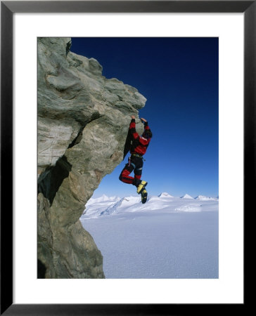 Mountain Climber Dangles From Rock On Pyramid Peak by Gordon Wiltsie Pricing Limited Edition Print image