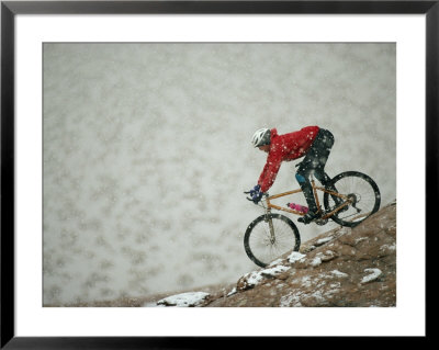 A Man Mountain-Biking Near Marble Canyon On The Utah Border by Bill Hatcher Pricing Limited Edition Print image