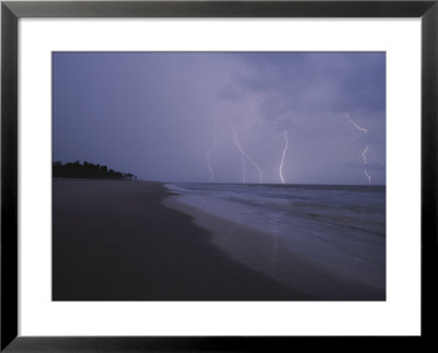 Lightning Illuminates The Coastline Of Gabons Loango National Park by Michael Nichols Pricing Limited Edition Print image