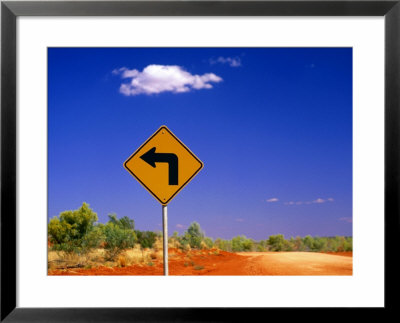 Road Sign Pointing To Rainbow Valley Road, Rainbow Valley Conservation Reserve, Australia by John Banagan Pricing Limited Edition Print image