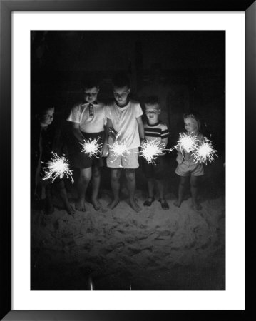 Children Holding Sparklers On A Beach by Lisa Larsen Pricing Limited Edition Print image