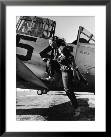 Female Pilot Of The Us Women's Air Force Service Posed With Her Leg Up On The Wing Of An Airplane by Peter Stackpole Pricing Limited Edition Print image