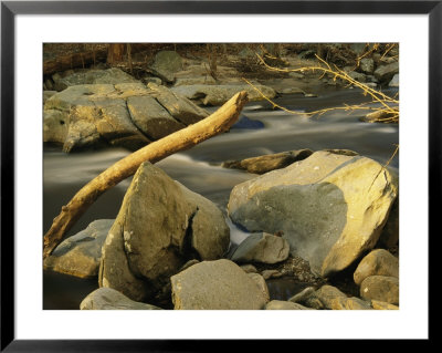 Rock Creek Rushes Past Large Boulders And Driftwood At Sunset by Raymond Gehman Pricing Limited Edition Print image