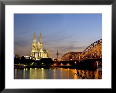 Cologne Cathedral And Hohenzollern Bridge At Night, Cologne, North Rhine Westphalia, Germany by Yadid Levy Pricing Limited Edition Print image