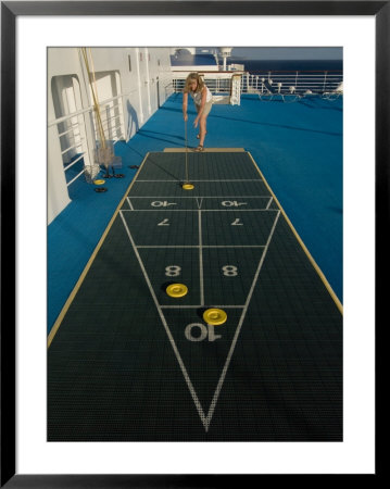 Woman Playing Shuffleboard Game On A Cruise Ship by Todd Gipstein Pricing Limited Edition Print image